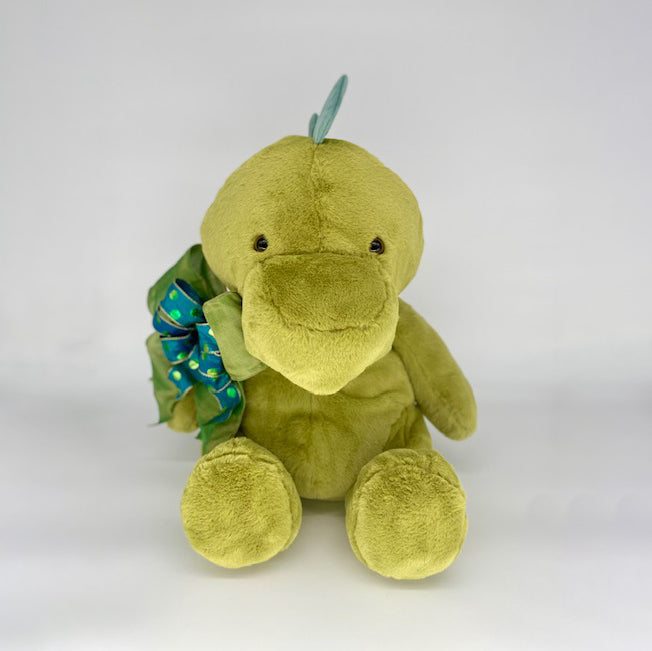 Dinosaur -  cuddly Dinosaur stands (or better yet, sits) approximately 2 feet tall. He is super soft & adorable 
