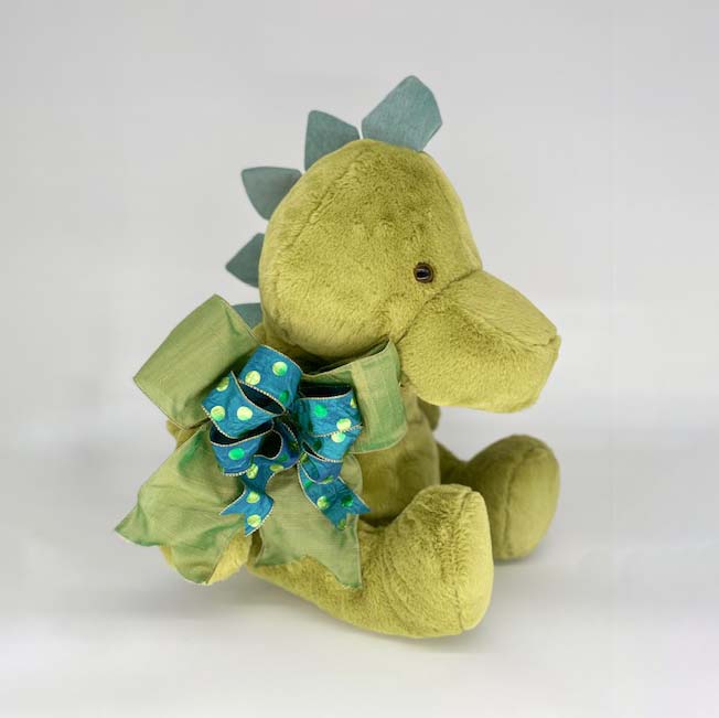 Dinosaur -  cuddly Dinosaur stands (or better yet, sits) approximately 2 feet tall. He is super soft & adorable 